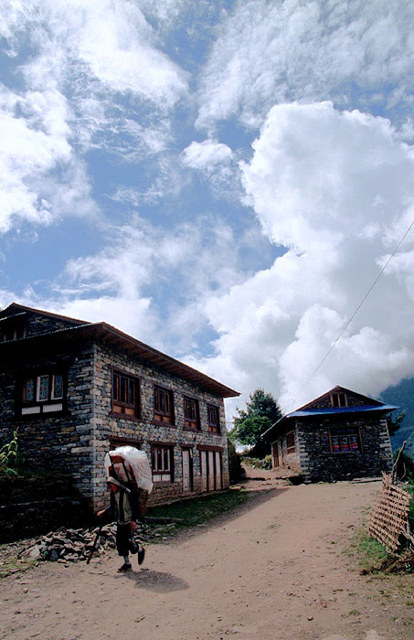 Porter walking through a small village
<br>
Photo: Robert Downie - 2004 (EOS 300)