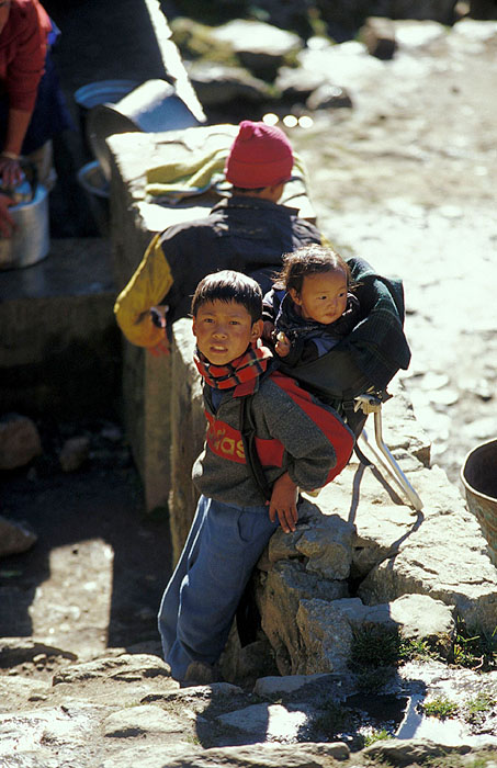 Boy with Baby - Namche Bazaar (3440m).
<br>
Photo: Robert Downie - 2004 (EOS 300)