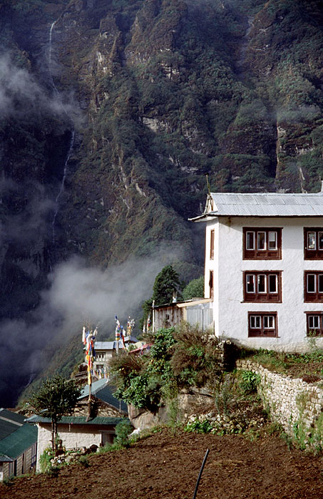 Namche Bazaar (3440m) - Notice the huge waterfall in the background.
<br>
Robert Downie - 2004 (EOS 300)