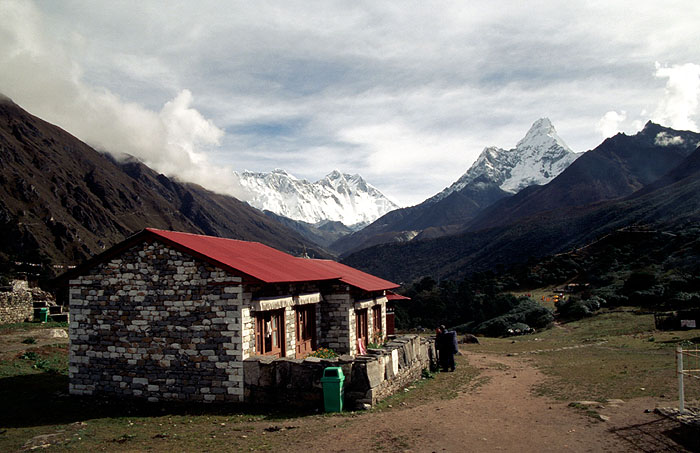 Monks quarters at 3870m.  Ama Dablam (6956m) on the right with great wall of Nuptse (7879m) and South face of Lhotse (8501m) down the valley.  Mt Everest is peaking over the top of Nuptse (8850m)- Tengboche Monastery 
<br>
Photo: Robert Downie - 2004 (EOS 300)