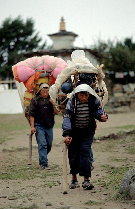 Porters waling past the Tengboche Monastery 
<br>
Photo: Robert Downie - 2004 (EOS 300)