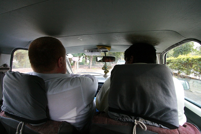 Mick crammed into a tiny Suzuki - Lahore 
<br>
Photo: Robert Downie - Feb 2007 (EOS 400D)