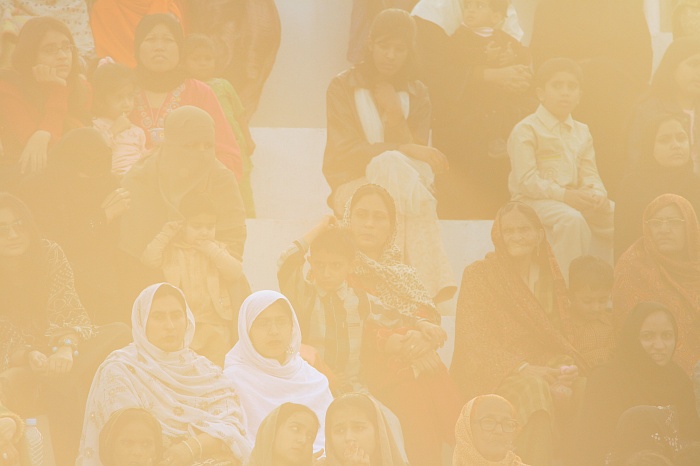 Sun sets as Pakistani women watch on in a segregated part of the crowd - Wagah Border
<br>
Photo: Robert Downie - Feb 2007 (EOS 400D)