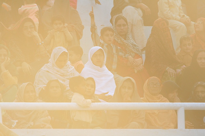 Sun sets as Pakistani women watch on in a segregated part of the crowd - Wagah Border
<br>
Photo: Robert Downie - Feb 2007 (EOS 400D)