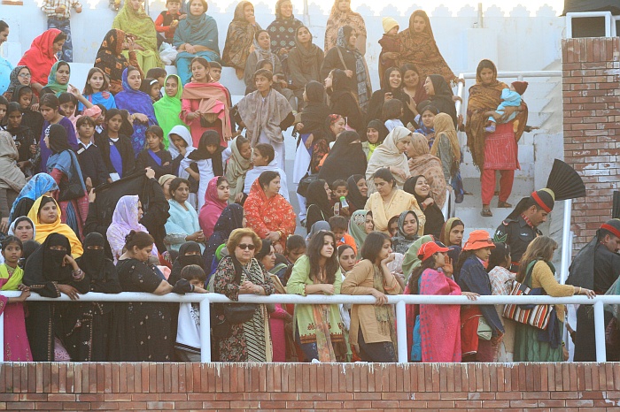 Sun sets as Pakistani women watch on in a segregated part of the crowd - Wagah Border
<br>
Photo: Robert Downie - Feb 2007 (EOS 400D)