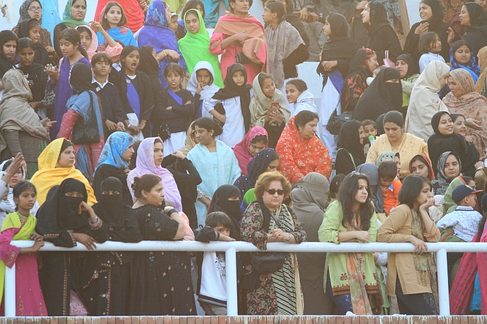 Sun sets as Pakistani women watch on in a segregated part of the crowd - Wagah Border
<br>
Photo: Robert Downie - Feb 2007 (EOS 400D)