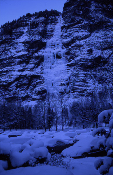 Car park at Stechelberg (922m) with frozen waterfall behind it 
<br>
This is as far as you can take a car
<br>
Photo: Robert Downie - January 2002 (EOS 300) 