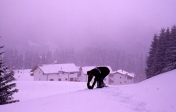 Ady strapping up for another days of hard work out the front of our chalet  - Valbella 
<br>
Photo: Robert Downie - February 2002 (EOS 300) 