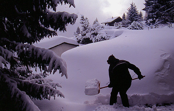 Ady shovelling snow to make the path out of the chalet - Valbella
<br>
Photo: Robert Downie - February 2002 (EOS 300) 