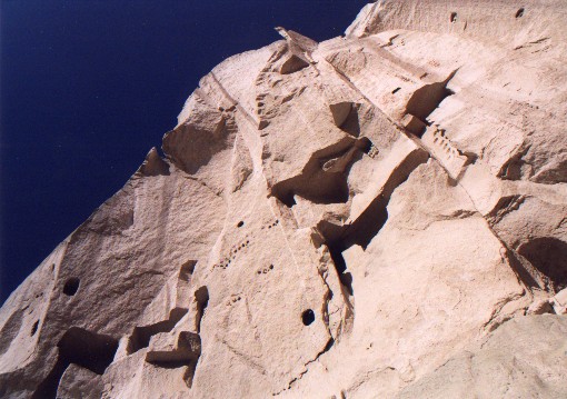 A once inhabited canyon.  One days walk from G�reme Valley.  The large holes are windows into the underground cities while the small black holes were for pidgins.
<br>
Photo: Robert Downie - January 2001 (EOS 300)
