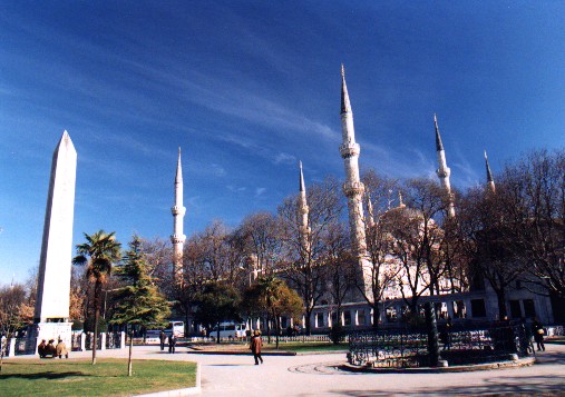 Looking accross the Hippodrome (Atmeydan? / Horse Grounds) towards Saltan Ahmet Camii (Blue Mosque) (1609-19 AD).  The Hippodrome was used for chariot races circa 203AD.  The Obelisk of Theodosius on the left is a Pharaonic column from the Temple of Karnak in southern Egypt close to 3500 years old.  
<br>
Photo: Robert Downie - January 2001 (EOS 300) 