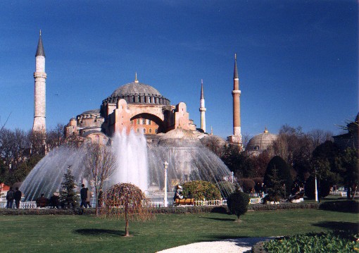 Looking accross Aultanahmet Square at the Aya Sofya, Church of the Divine Wisdom (Hagia Sofia in Greek, Sancta Sophia in Latin).  Construction was initiated by the Byzantine emperor Justinian in 532 AD.  It was superseded by the St Peters's Chapel in Rome almost 1000 years later as the largest house of worship in the world.
<br>
Photo: Robert Downie - January 2001 (EOS 300)