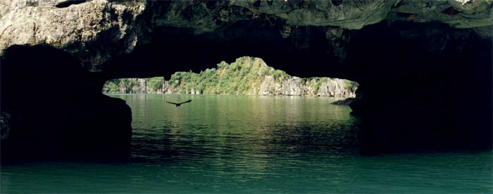 Small cave leading into an enclosed atoll - Halong Bay
<br>
Photo: Robert Downie - December 1998 (EOS IX) 